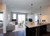 Thumbnail 3 of 25 - Kitchen and Living Room