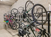Thumbnail 30 of 31 - A bike rack full of bicycles in a garage.