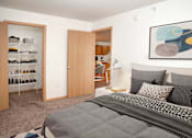 Thumbnail 6 of 14 - Spacious and bright bedroom with large closets for storage.