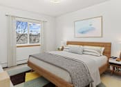 Thumbnail 7 of 14 - a bedroom with a bed and a window