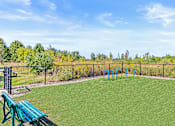 Thumbnail 9 of 14 - the backyard has a playground and a picnic table