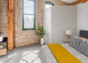 Thumbnail 10 of 16 - a bedroom with a bed and a window