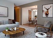 Thumbnail 3 of 20 - Furnished Living Room with Wall Art, Coffee Table and Couch