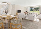 Thumbnail 1 of 18 - a living room and dining room with a table and chairs