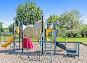 Thumbnail 15 of 18 - a playground with a slide and other play equipment