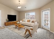 Thumbnail 4 of 24 - a living room with a couch and a tv