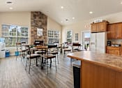 Thumbnail 21 of 24 - the kitchen and dining area of a home with a table and chairs