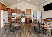 Thumbnail 20 of 24 - a kitchen and dining area with a table and chairs