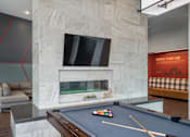 Thumbnail 22 of 30 - A pool table with a green cloth and a set of pool balls on it.
