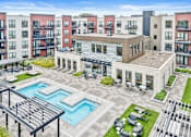 Thumbnail 20 of 36 - A large building with a pool in the middle of a courtyard.