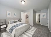 Thumbnail 16 of 33 - Large bedroom with spacious walk in closet and space to spare.