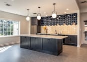 Thumbnail 19 of 33 - Community kitchen perfect for entertaining friends and family.