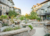 Thumbnail 10 of 20 - a backyard with a patio and a fire pit