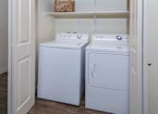Thumbnail 30 of 40 - Convenient closet housing in unit washer and dryer side by side.