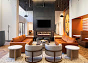 Thumbnail 4 of 40 - a large living room with a fireplace and a large painting on the wall