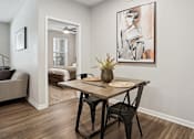 Thumbnail 7 of 40 - an open living room and dining room with a table and chairs