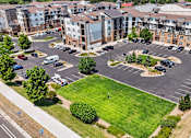 Thumbnail 2 of 40 - an aerial view of an empty parking lot in front of an apartment building