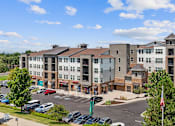 Thumbnail 40 of 40 - an aerial view of an apartment complex with a parking lot