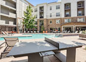 Thumbnail 18 of 40 - our apartments have a resort style pool and community table