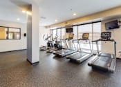 Thumbnail 11 of 27 - Fitness center with hard rubber flooring, 3 treadmills and 2 ellipticals