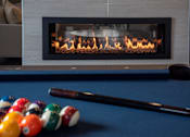 Thumbnail 26 of 27 - Pool table, with balls and stick in the foreground, fireplace in the background