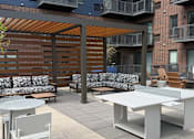 Thumbnail 42 of 45 - A patio with a white table and chairs.