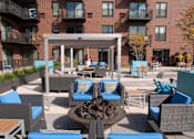 Thumbnail 19 of 27 - Outdoor fire pit with surrounding lounge furniture
