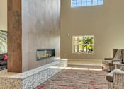 Thumbnail 14 of 24 - a living room with couches and a fireplace