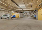 Thumbnail 24 of 24 - the inside of a parking garage with cars parked in it