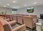 Thumbnail 12 of 24 - a meeting room with chairs and a television on the wall