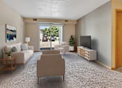 Thumbnail 2 of 11 - a living room with a couch and chairs and a television