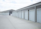 Thumbnail 7 of 9 - Large driveway with detached garage parking available.