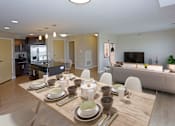 Thumbnail 3 of 9 - Open concept dining area, living room and kitchen.