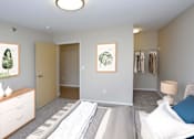Thumbnail 4 of 9 - Spacious bedroom with open closet in the right corner.