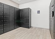 Thumbnail 36 of 40 - a row of black lockers in a white room