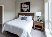 Thumbnail 7 of 40 - a bedroom with a large bed and a closet