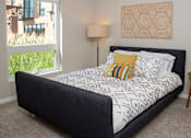 Thumbnail 8 of 40 - a bedroom with a bed and a window
