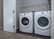 Thumbnail 10 of 40 - Convenient closet off the main living area with full size front load washer/dryer.