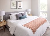 Thumbnail 14 of 58 - a bedroom with a large bed and two windows