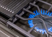 Thumbnail 9 of 58 - a blue flame on a gas stove