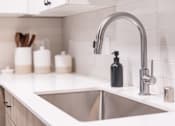 Thumbnail 7 of 58 - a kitchen sink and faucet in a 555 waverly unit