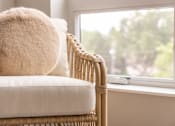 Thumbnail 13 of 58 - a chair with a white cushion next to a window