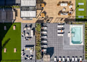 Thumbnail 34 of 58 - a birdseye view of a backyard with a pool and lawn