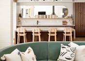 Thumbnail 28 of 58 - a living room filled with furniture and a large window