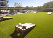 Thumbnail 33 of 58 - a lounge area on the roof of a building with a blue sky in the background