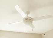 Thumbnail 17 of 58 - a white ceiling fan hanging from a ceiling with a window in the background