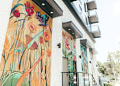 Thumbnail 56 of 58 - a building with a mural on the side of it