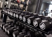 Thumbnail 47 of 58 - a rack of dumbbells in a gym