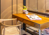 Thumbnail 42 of 58 - a desk with a book and a clock on top of it