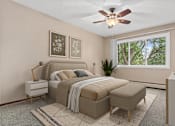 Thumbnail 14 of 34 - A bedroom with a bed, a bench, and a ceiling fan.